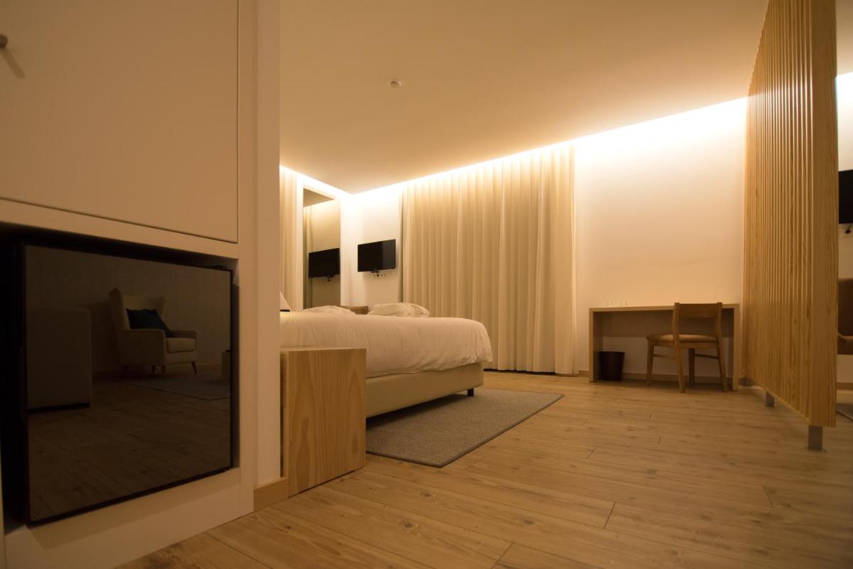 Uma cama ou camas num quarto em LAM Hotel Celorico de Basto