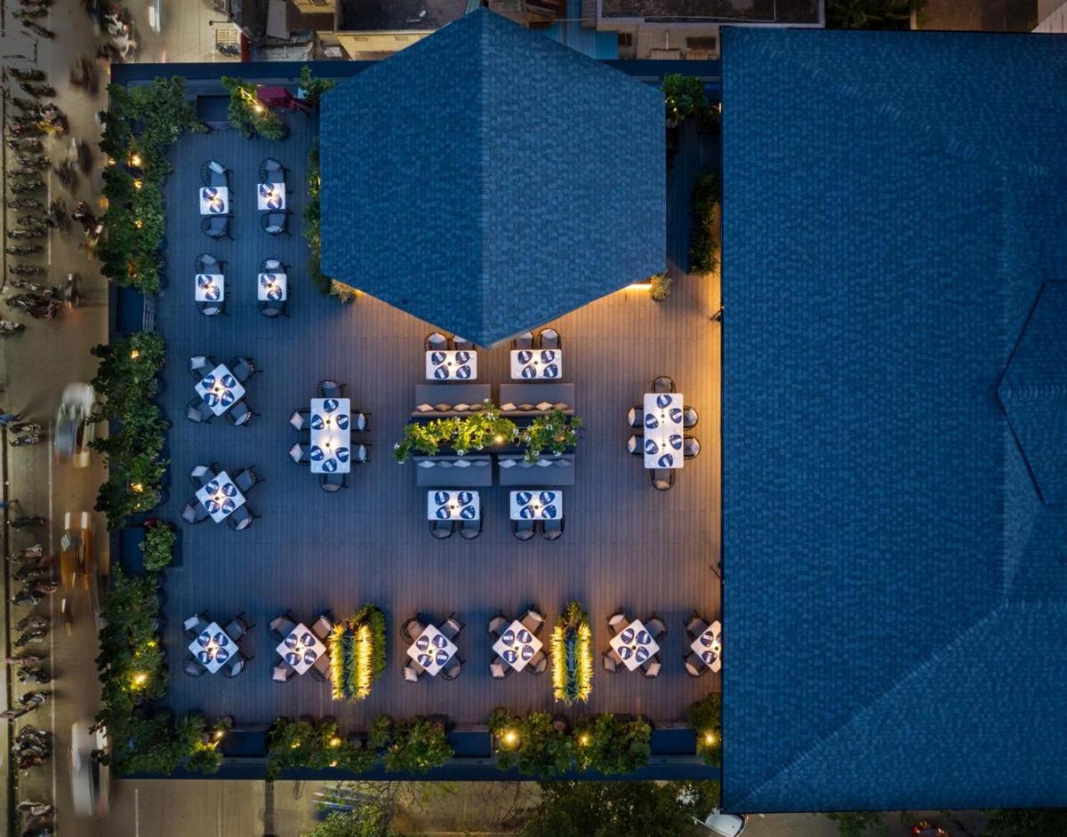 an overhead view of a building with a blue roof at The Residency Towers Puducherry in Puducherry