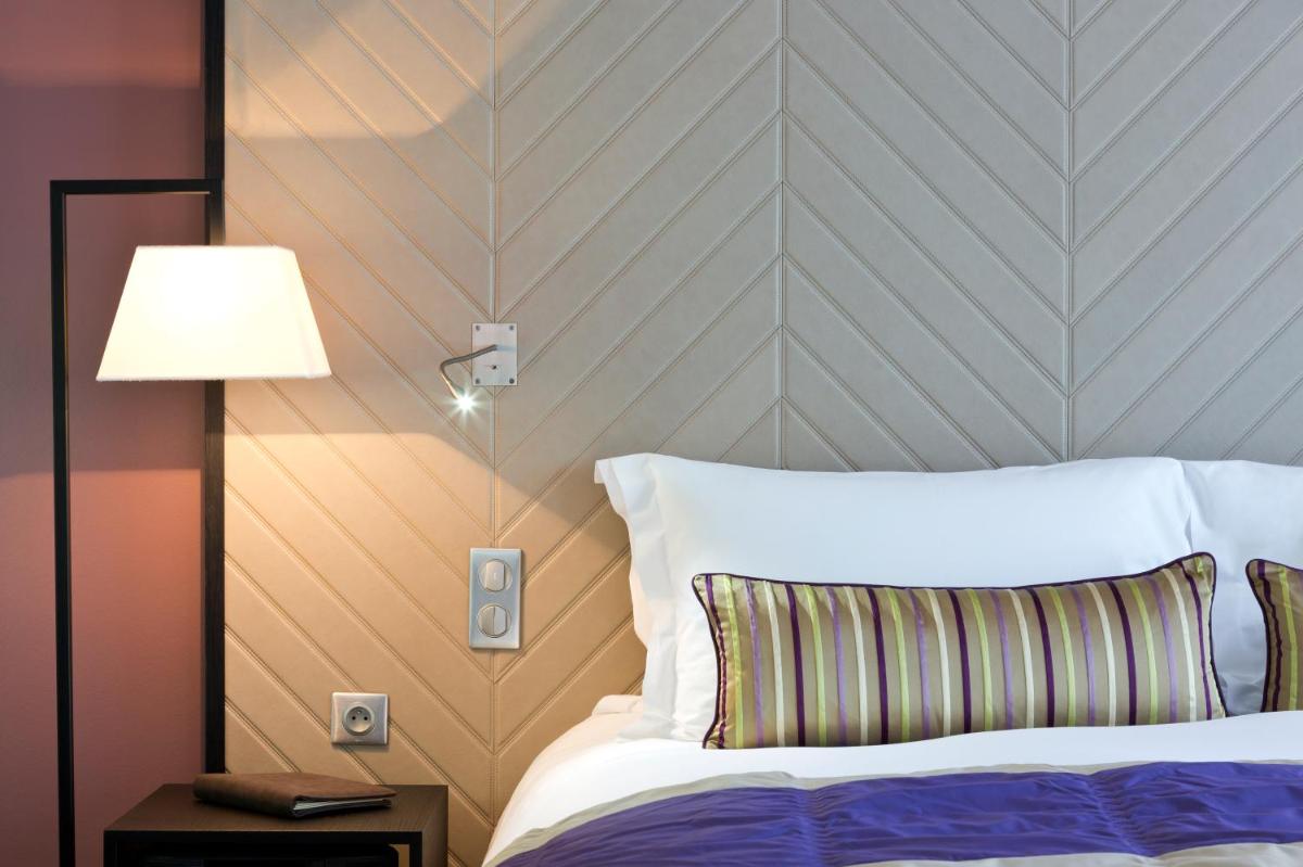 Un ou plusieurs lits dans un hébergement de l'établissement Sofitel Strasbourg Grande Ile