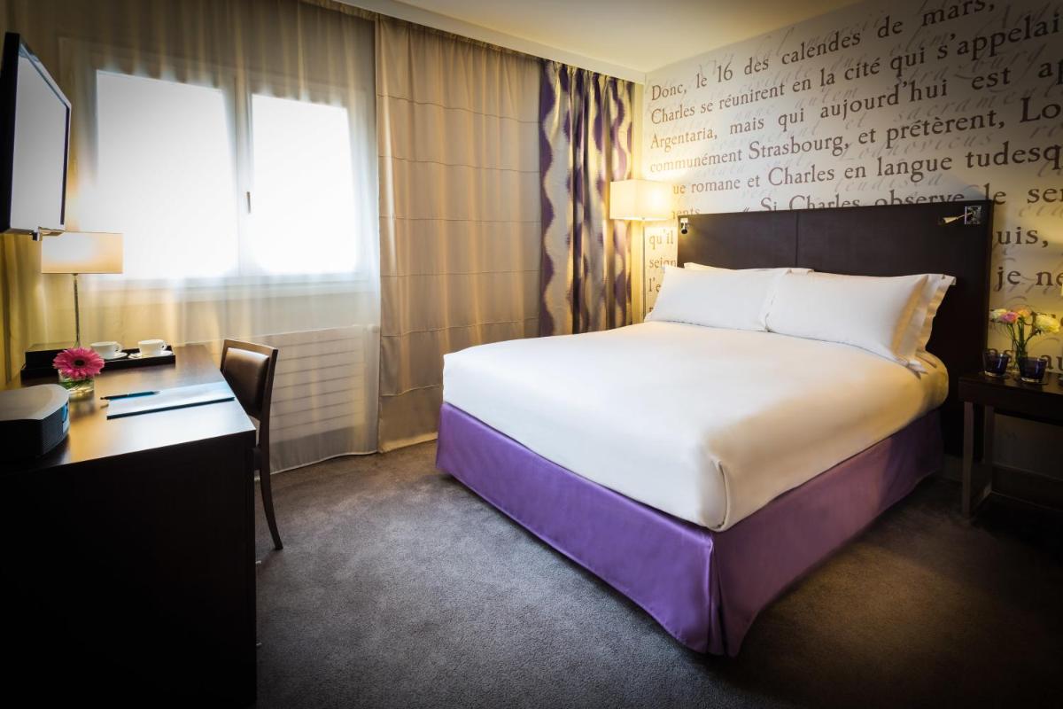 Un ou plusieurs lits dans un hébergement de l'établissement Sofitel Strasbourg Grande Ile