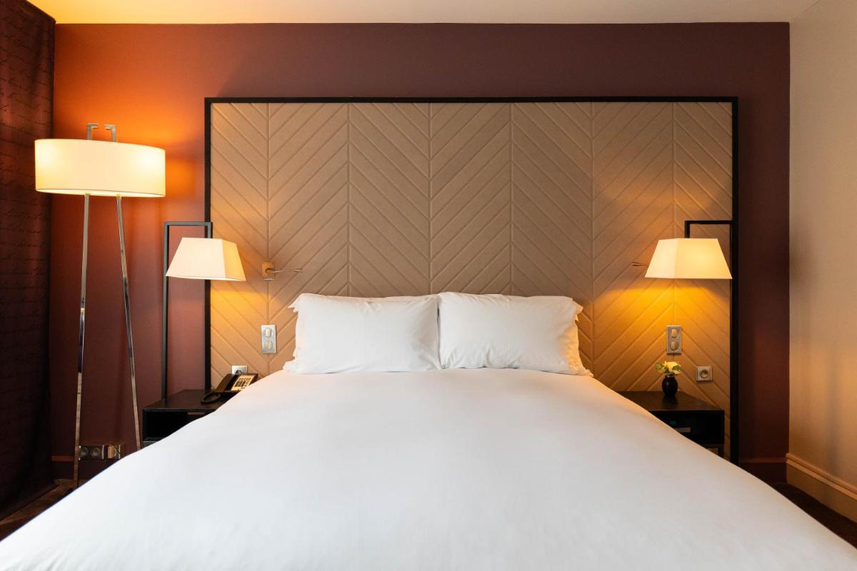 Un ou plusieurs lits dans un hébergement de l'établissement Sofitel Strasbourg Grande Ile