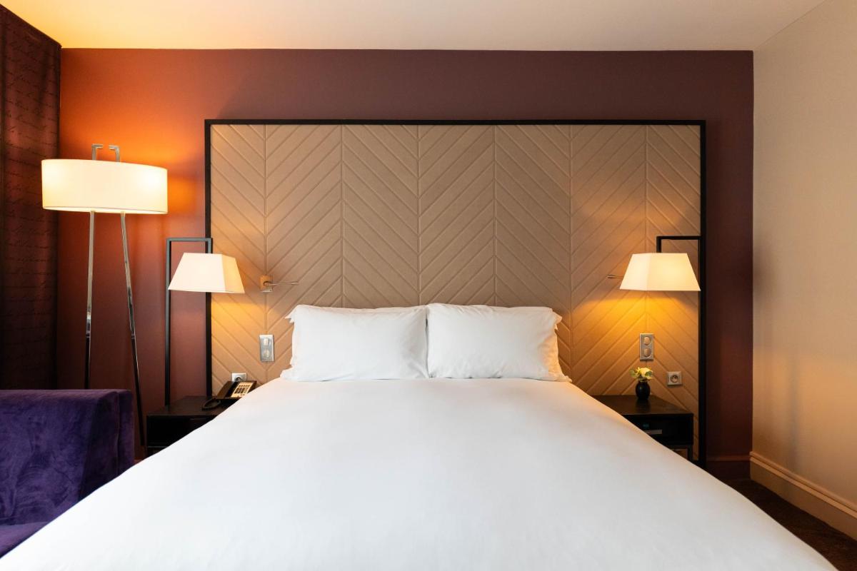 Un ou plusieurs lits dans un hébergement de l'établissement Sofitel Strasbourg Grande Ile