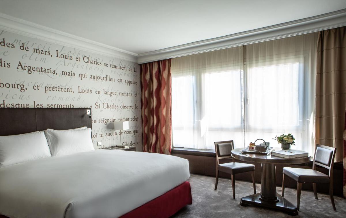 Un ou plusieurs lits dans un hébergement de l'établissement Sofitel Strasbourg Grande Ile