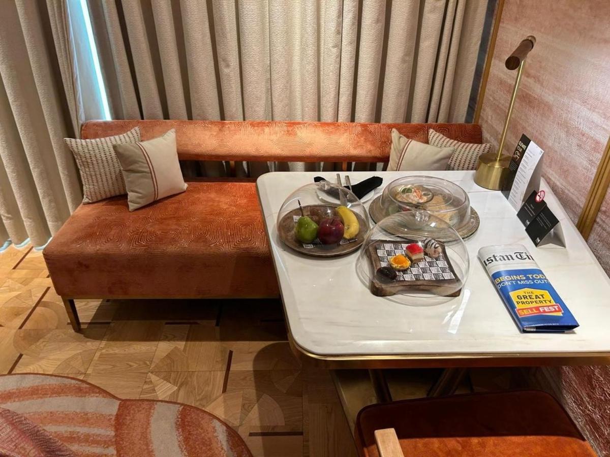 a table with a tray of food on it at The Park New Delhi in New Delhi