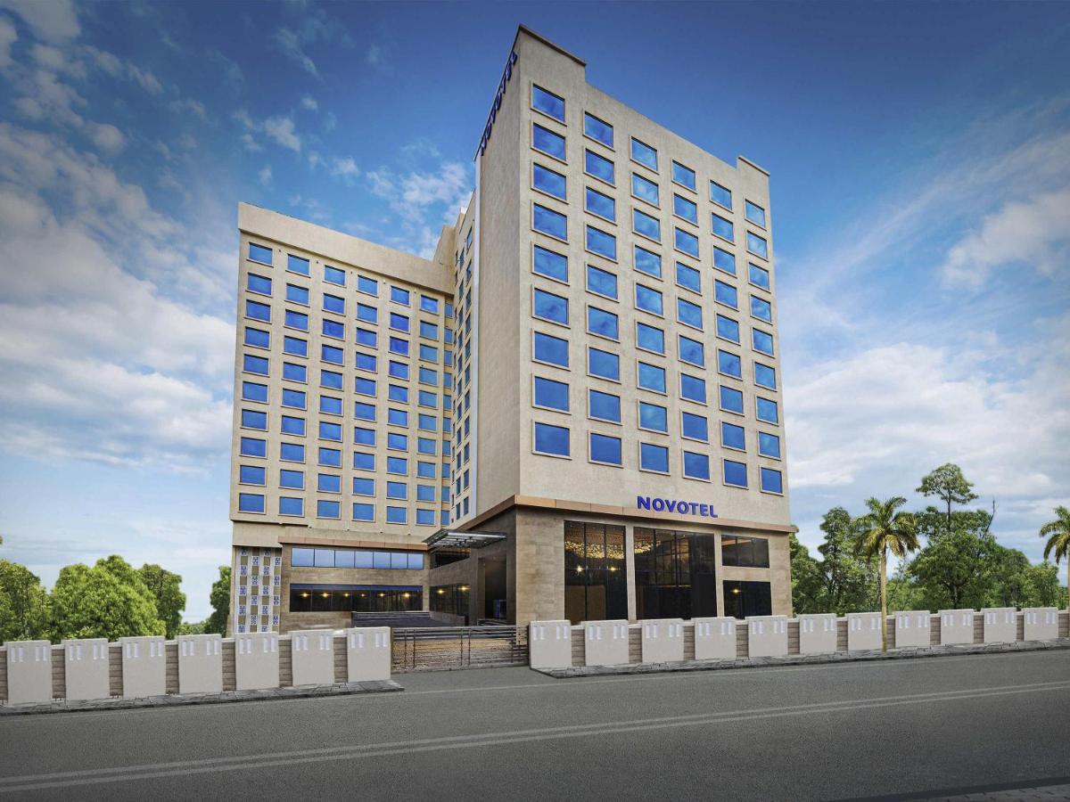 a rendering of a hotel with a building at Novotel Mumbai International Airport in Mumbai
