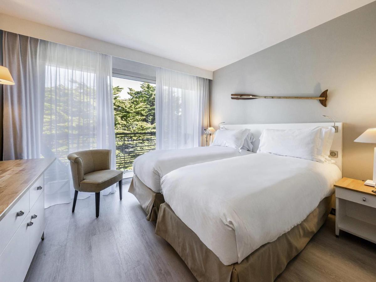 Un ou plusieurs lits dans un hébergement de l'établissement Sofitel Quiberon Thalassa sea & spa