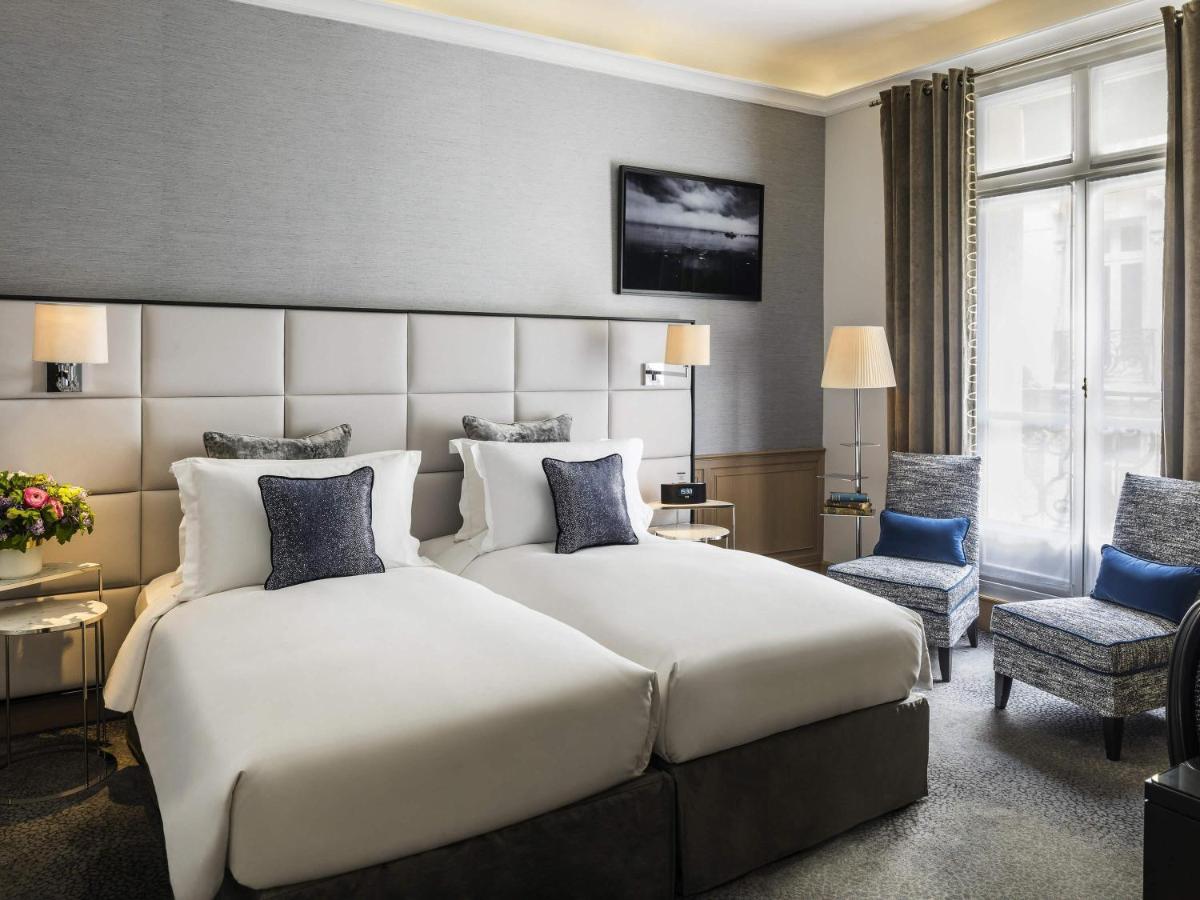 Un ou plusieurs lits dans un hébergement de l'établissement Sofitel Paris Baltimore Tour Eiffel