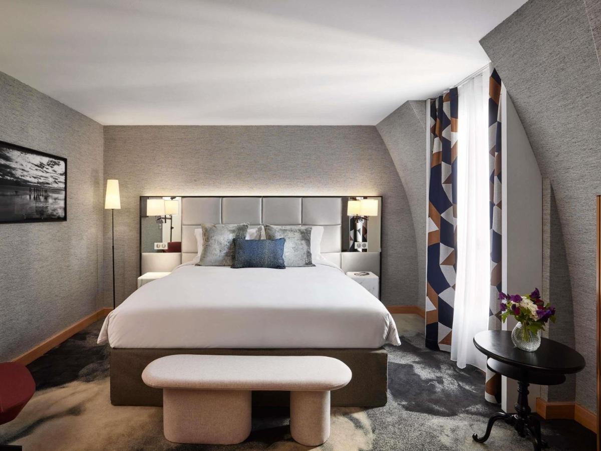Un ou plusieurs lits dans un hébergement de l'établissement Sofitel Paris Baltimore Tour Eiffel