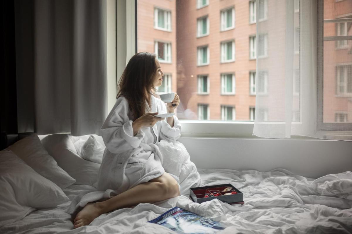 Ein Bett oder Betten in einem Zimmer der Unterkunft Grand Hyatt Berlin
