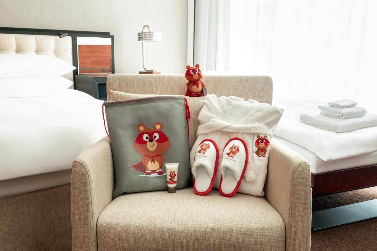Ein Bett oder Betten in einem Zimmer der Unterkunft Grand Hyatt Berlin