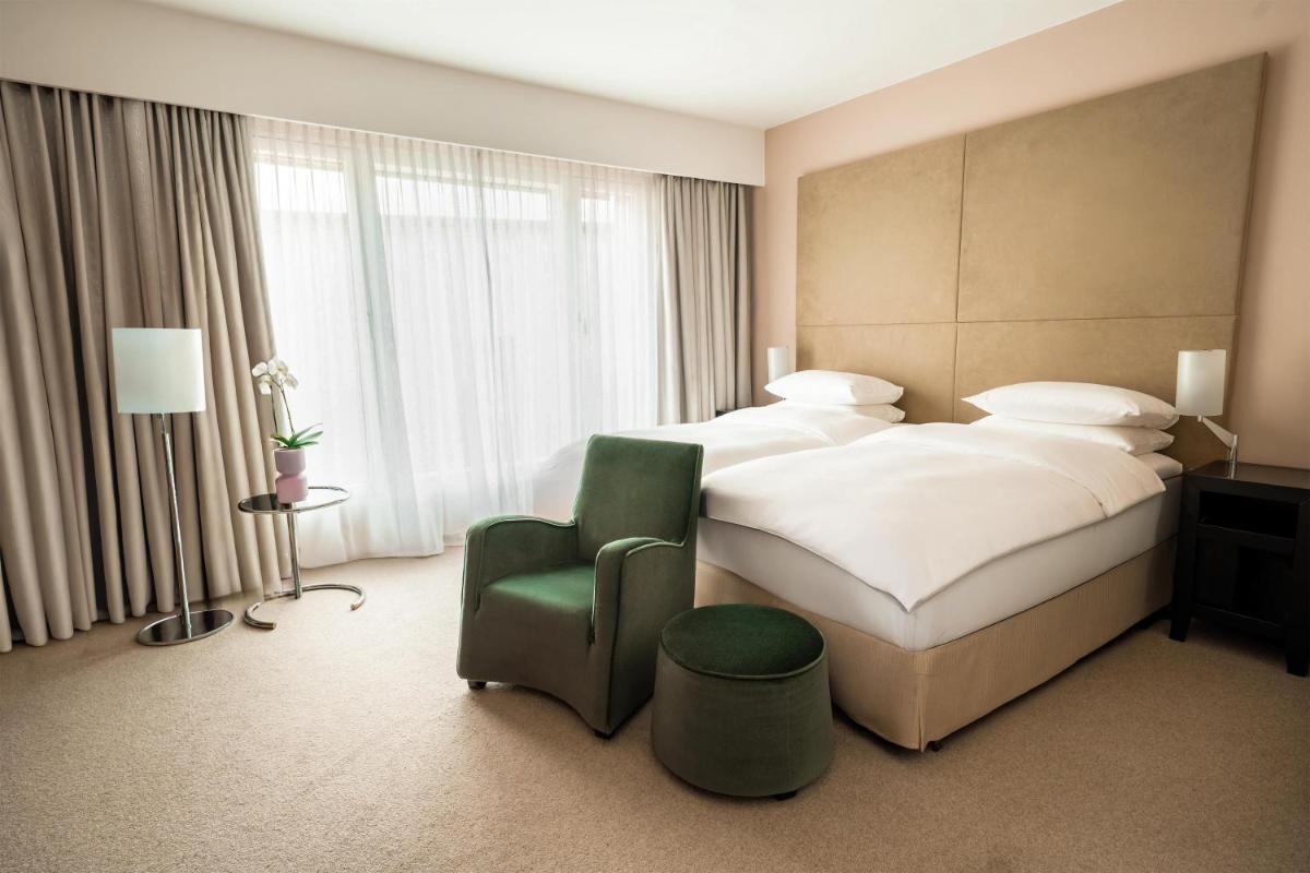Ein Bett oder Betten in einem Zimmer der Unterkunft Grand Hyatt Berlin