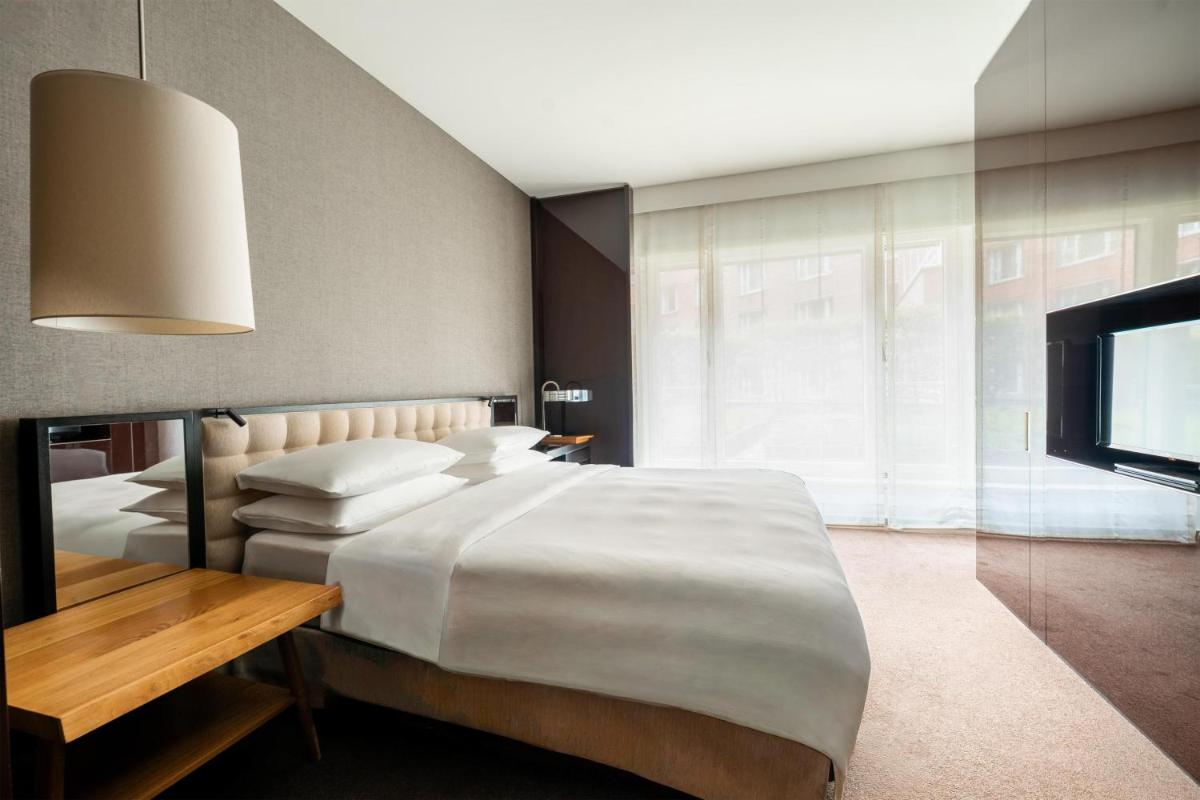 Ein Bett oder Betten in einem Zimmer der Unterkunft Grand Hyatt Berlin