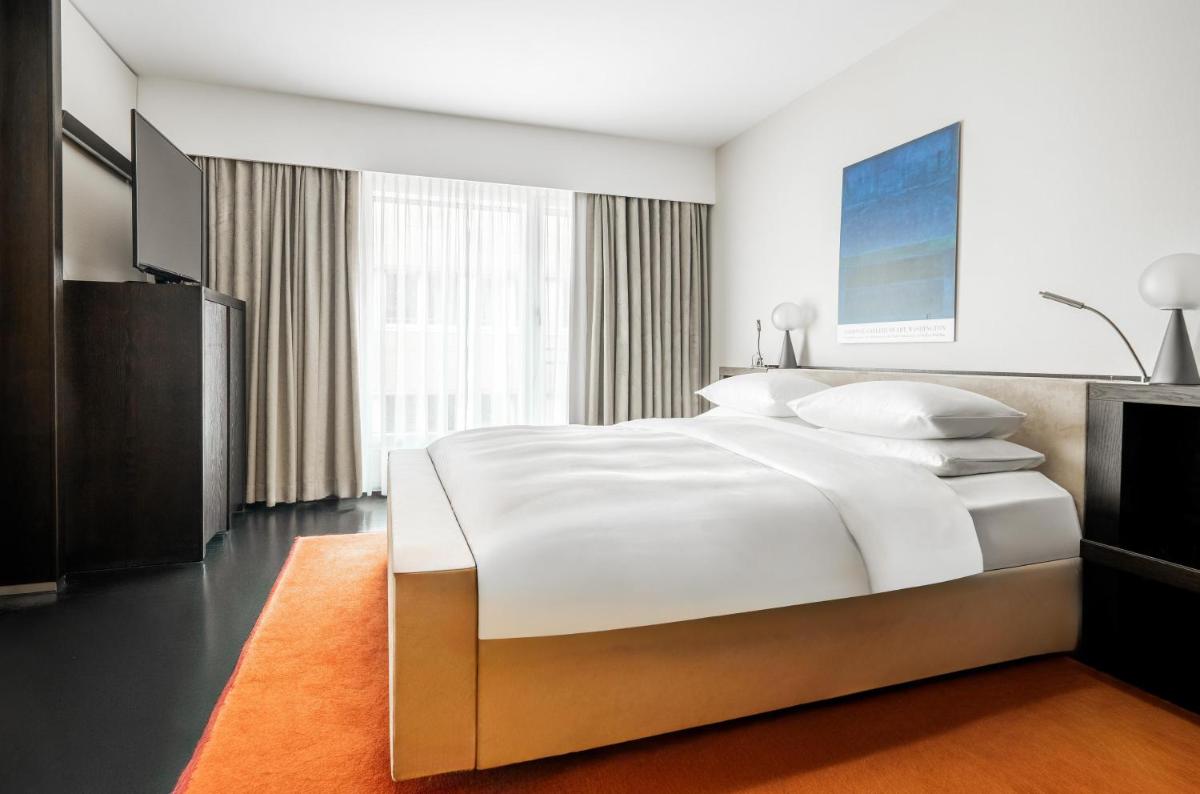 Ein Bett oder Betten in einem Zimmer der Unterkunft Grand Hyatt Berlin