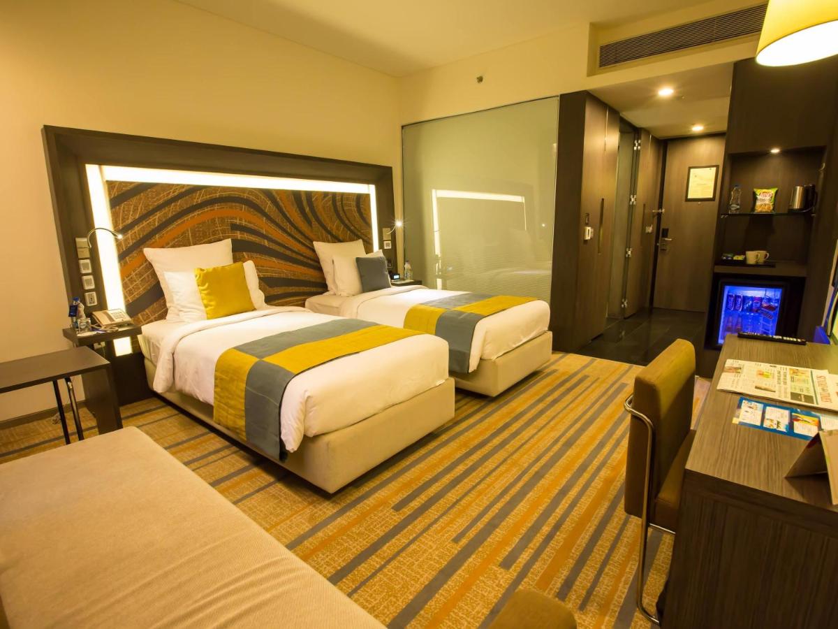 Cama o camas de una habitación en Novotel Kolkata Hotel and Residences