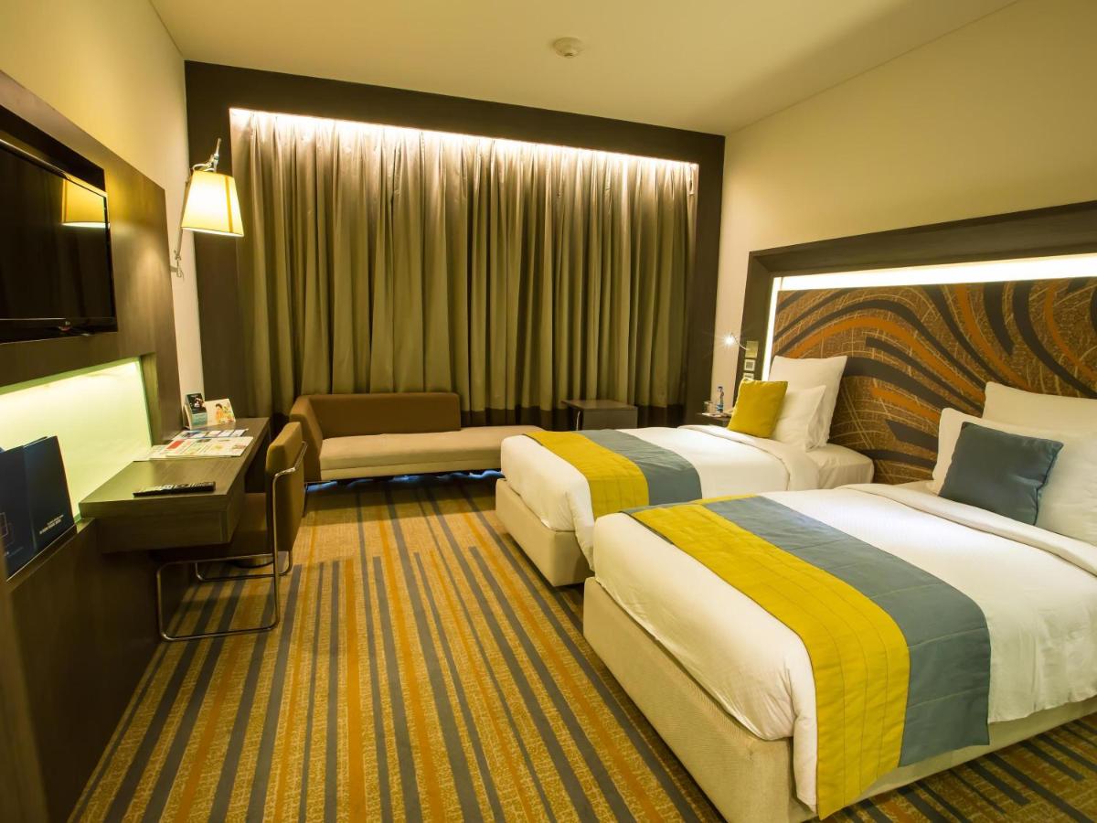 Cama o camas de una habitación en Novotel Kolkata Hotel and Residences