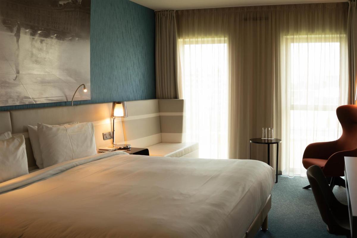 Un ou plusieurs lits dans un hébergement de l'établissement Radisson Blu Hotel Bordeaux