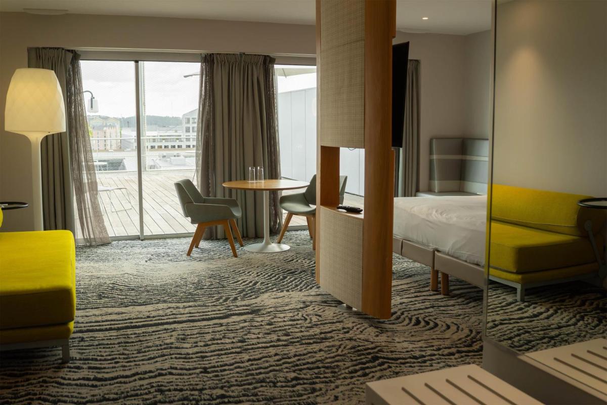 Un ou plusieurs lits dans un hébergement de l'établissement Radisson Blu Hotel Bordeaux