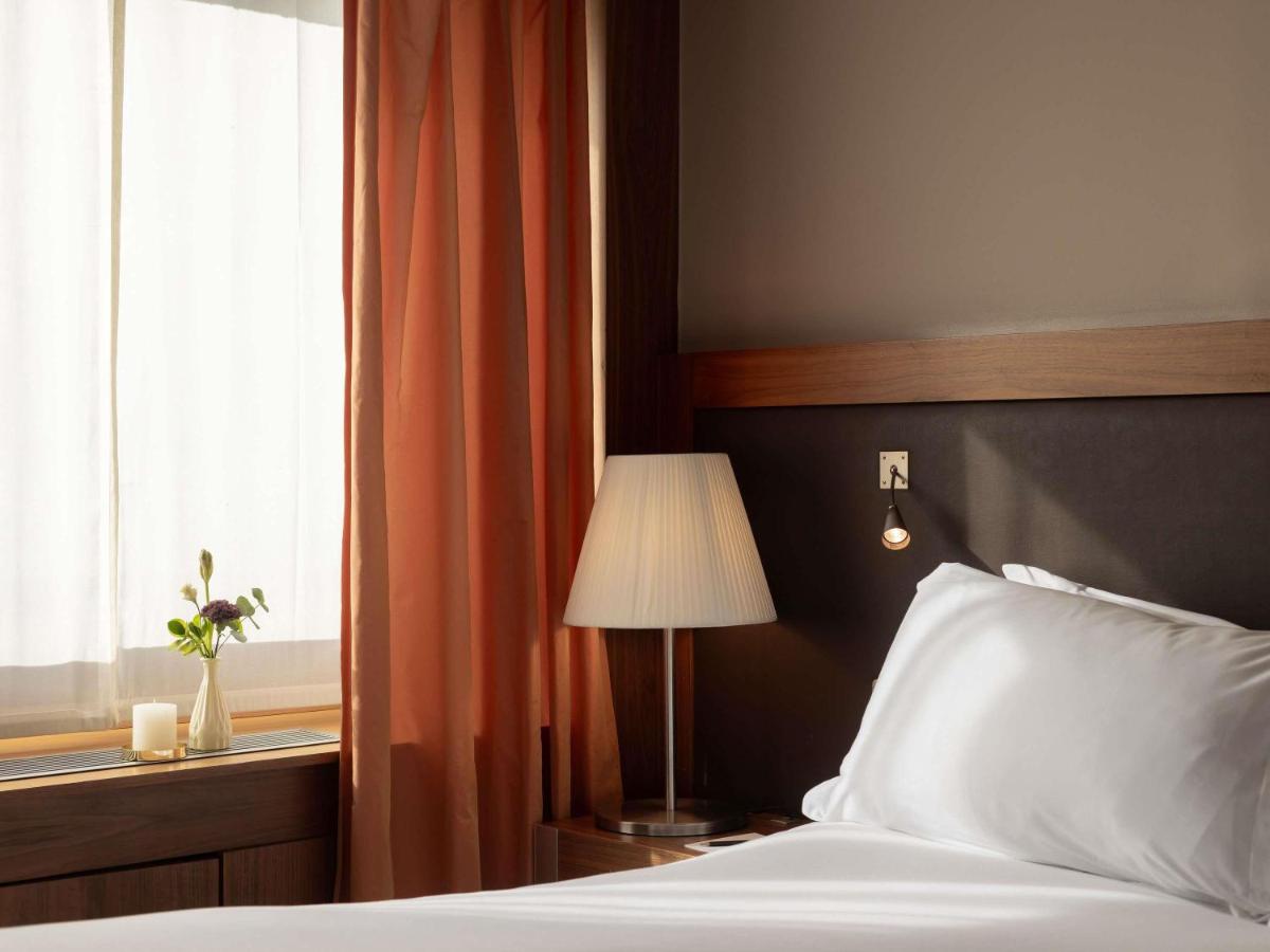 Un ou plusieurs lits dans un hébergement de l'établissement Sofitel Lyon Bellecour