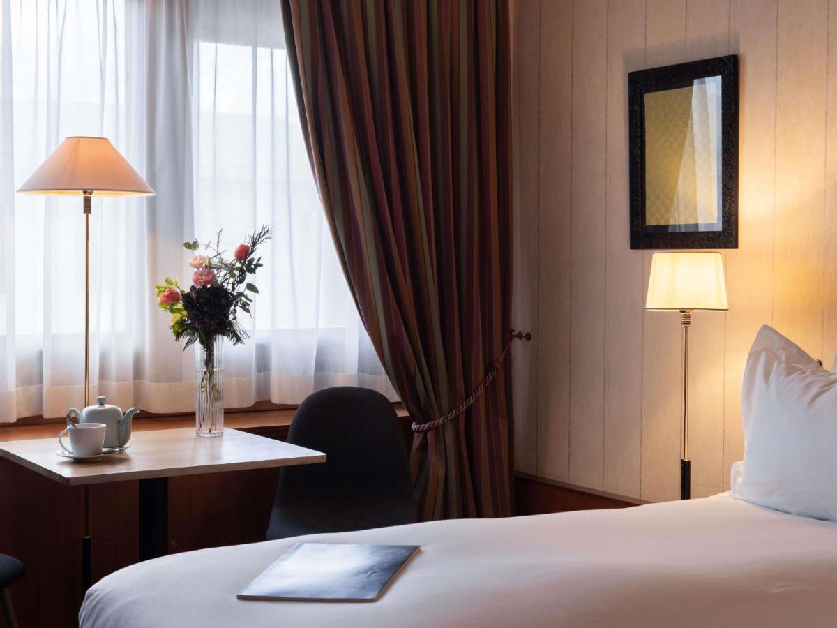 Un ou plusieurs lits dans un hébergement de l'établissement Sofitel Lyon Bellecour