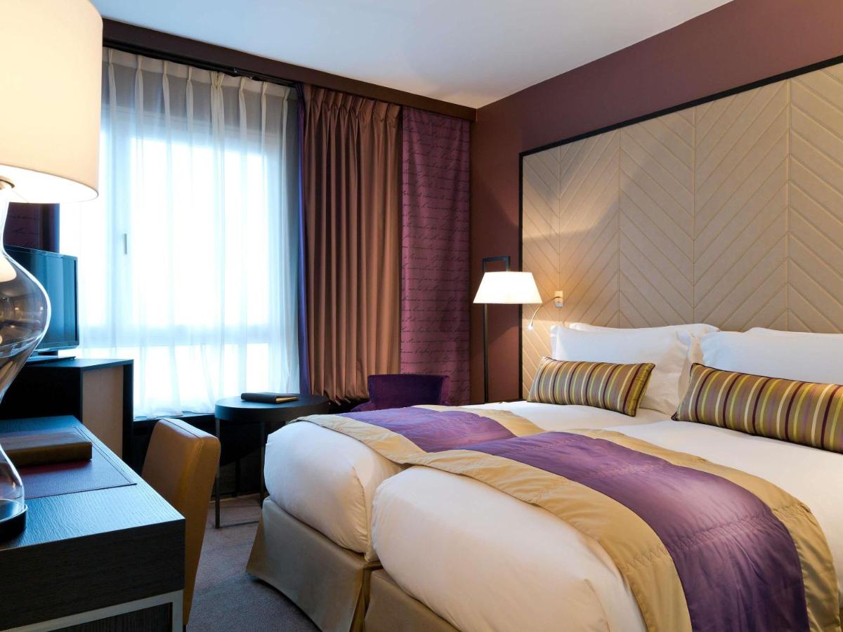 Un ou plusieurs lits dans un hébergement de l'établissement Sofitel Strasbourg Grande Ile