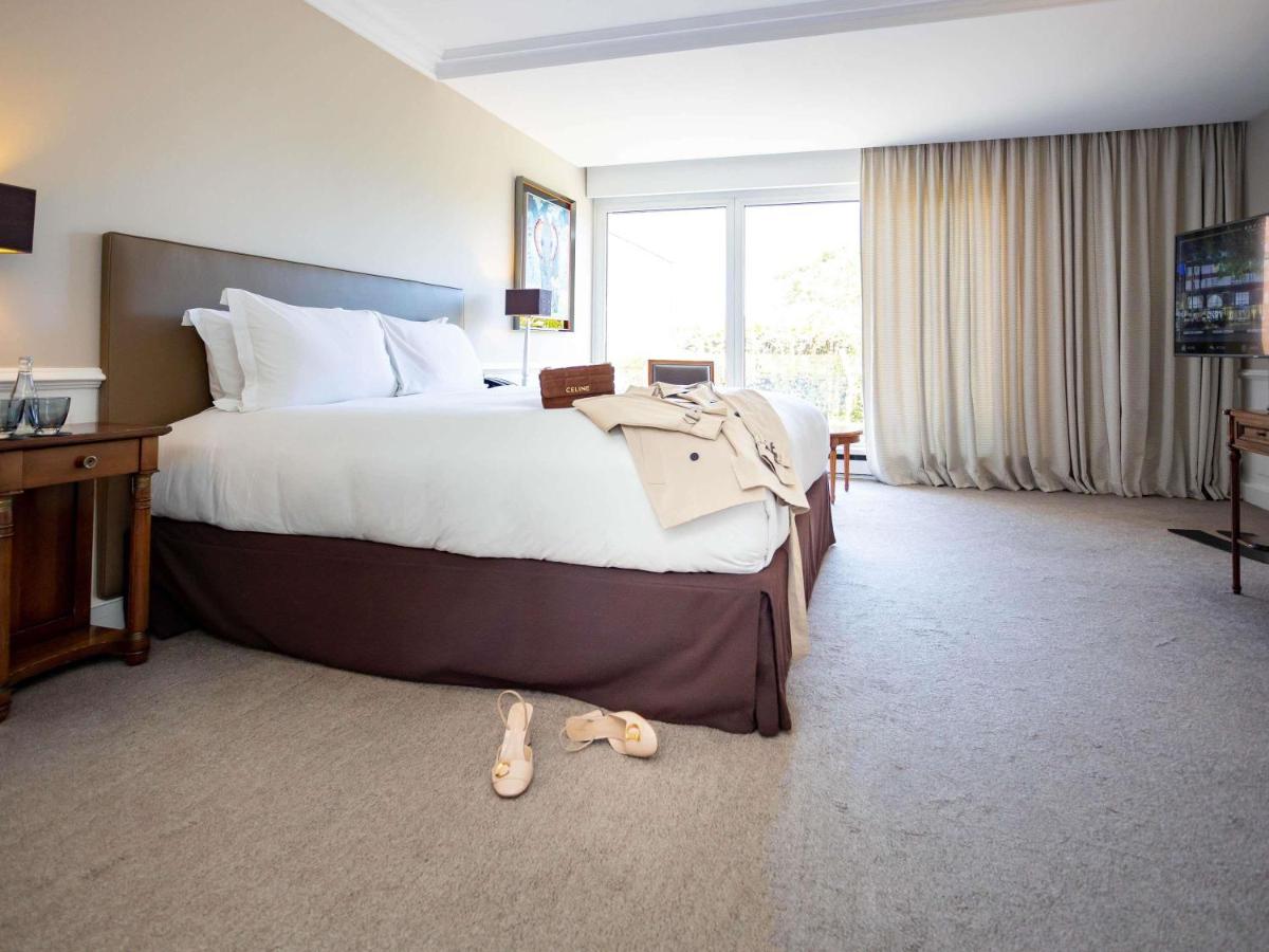 Un ou plusieurs lits dans un hébergement de l'établissement Sofitel Strasbourg Grande Ile