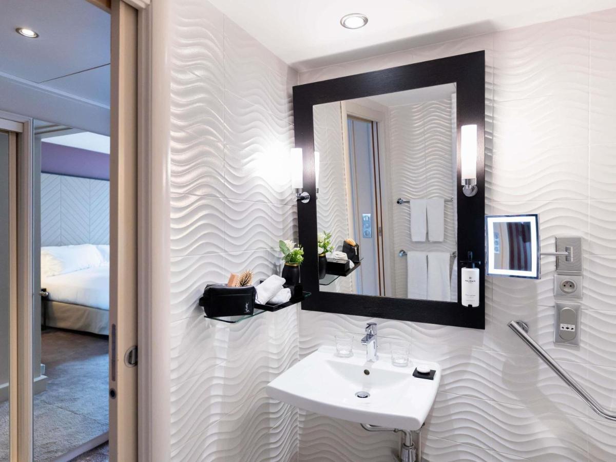 Un ou plusieurs lits dans un hébergement de l'établissement Sofitel Strasbourg Grande Ile
