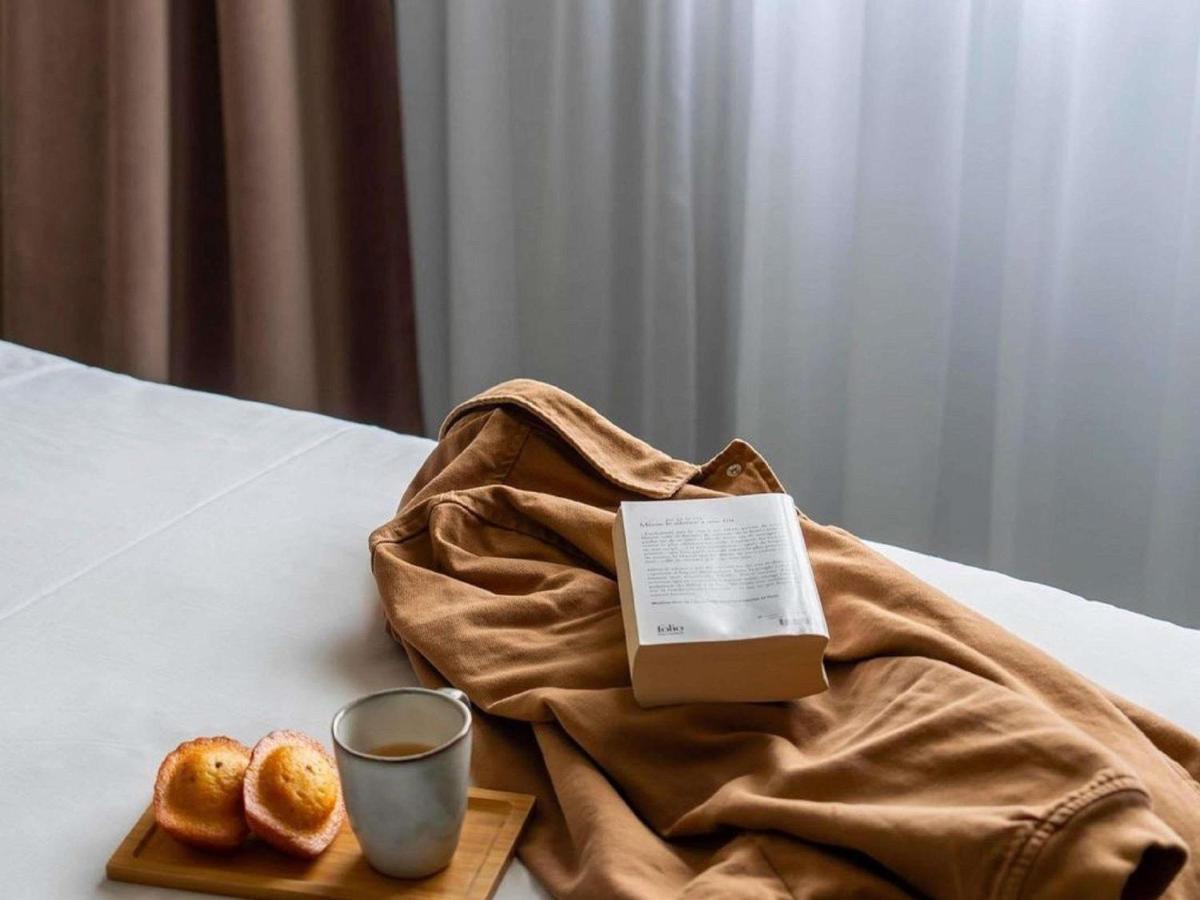 Un ou plusieurs lits dans un hébergement de l'établissement Hotel Mercure Parc du Coudray - Barbizon