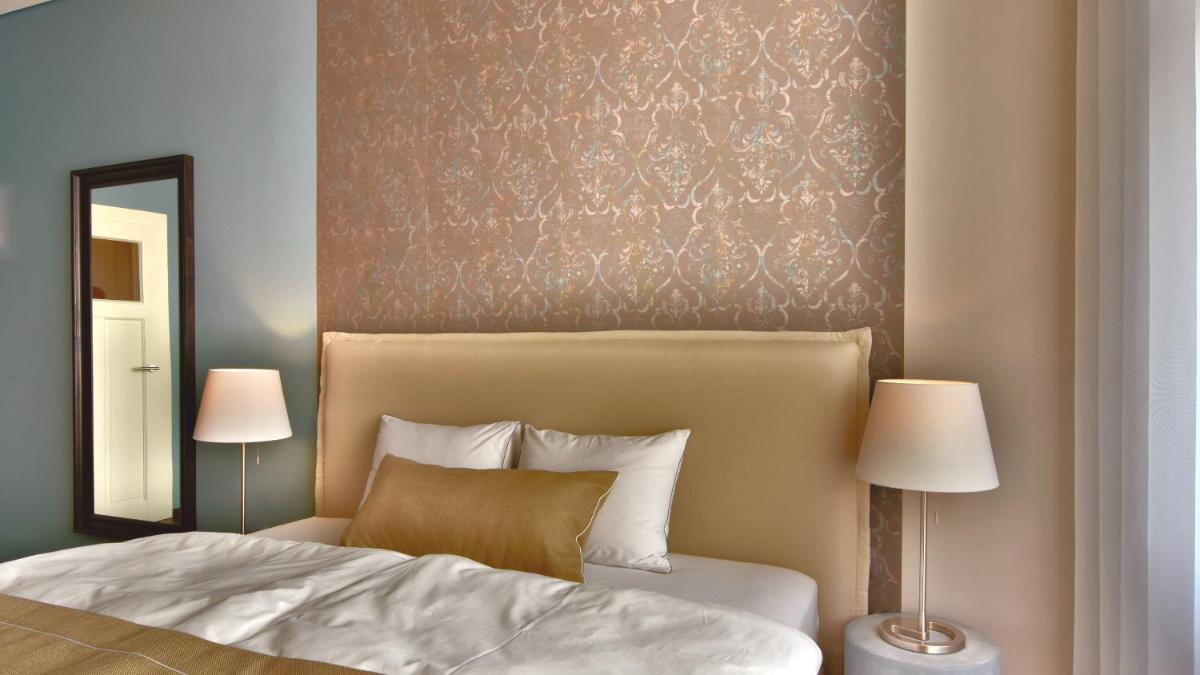 Ein Bett oder Betten in einem Zimmer der Unterkunft Carl.22 City Appartements