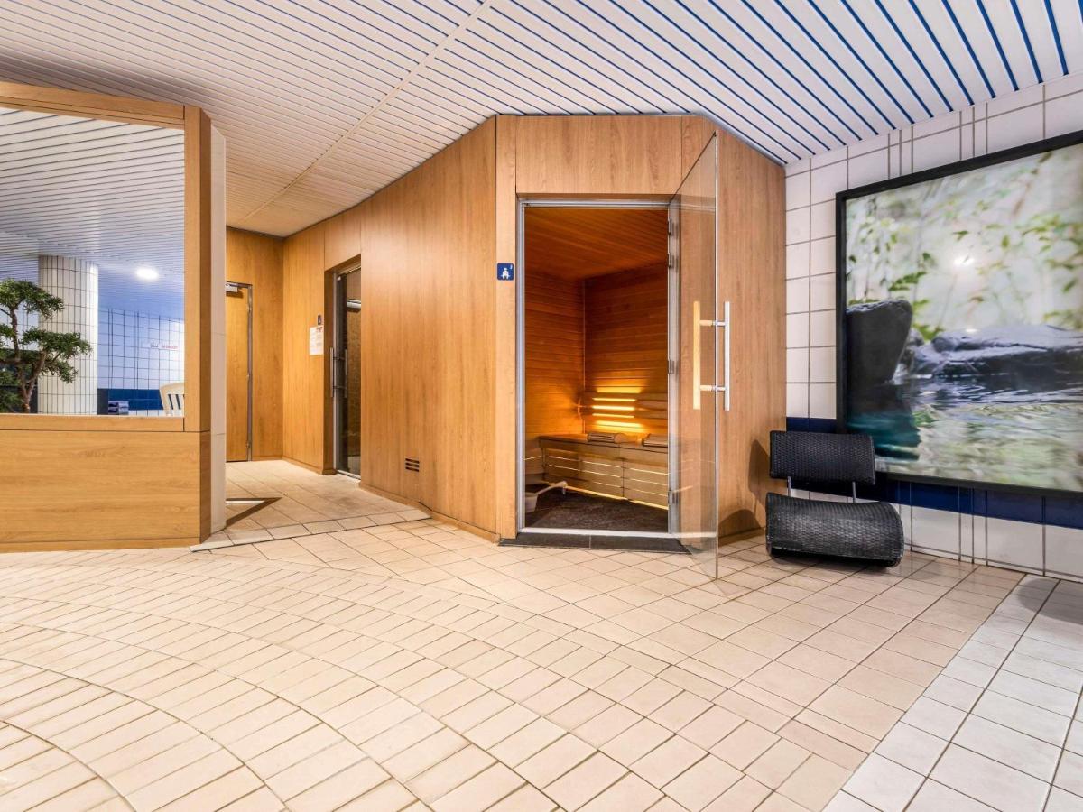 Télévision ou salle de divertissement dans l'établissement Mercure Tours Sud