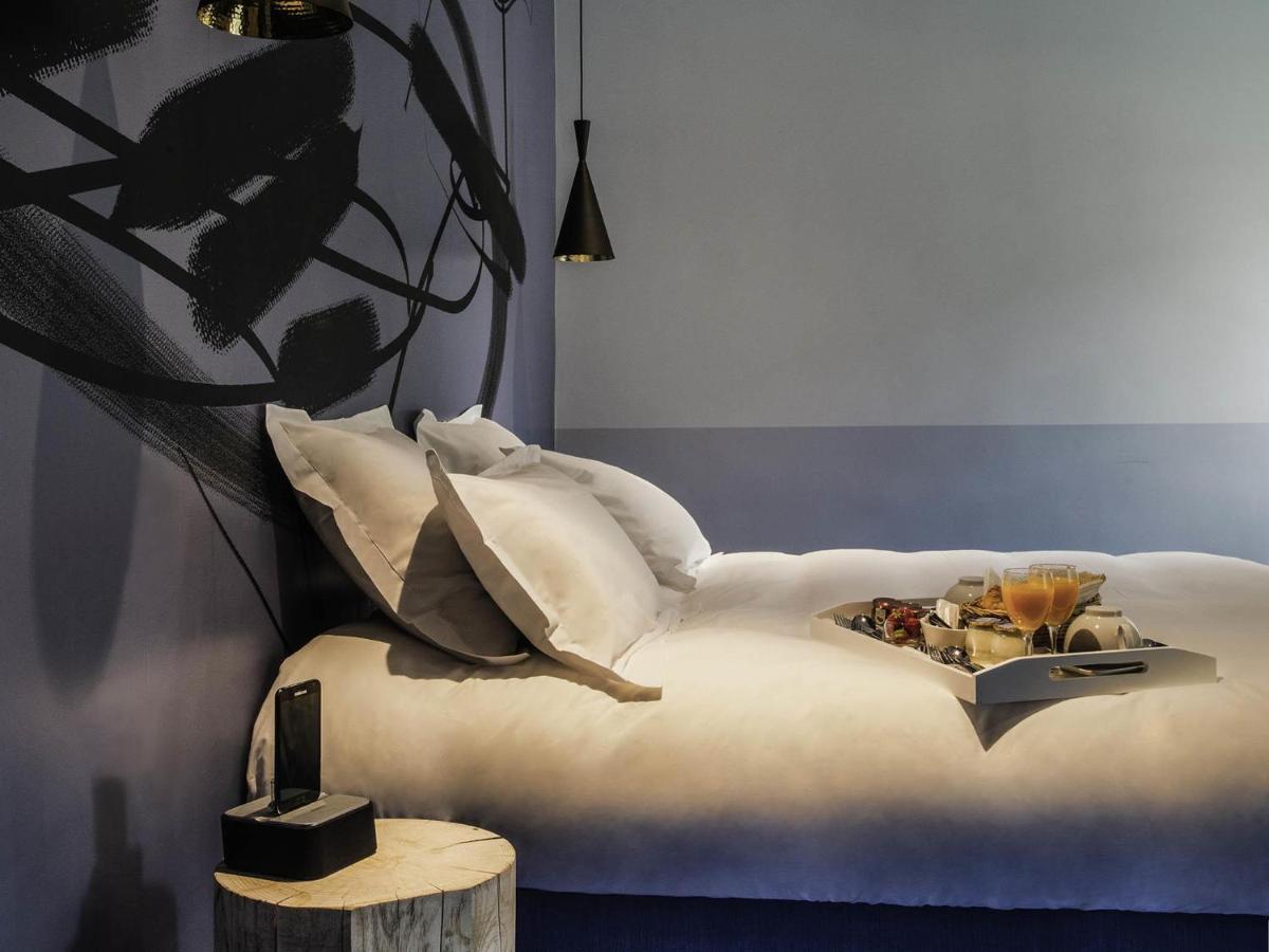 Un ou plusieurs lits dans un hébergement de l'établissement Jules César Hotel & Spa Arles - MGallery Collection