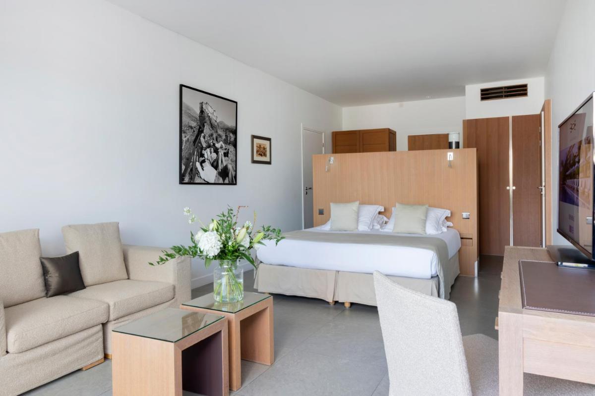 Un ou plusieurs lits dans un hébergement de l'établissement Casadelmar