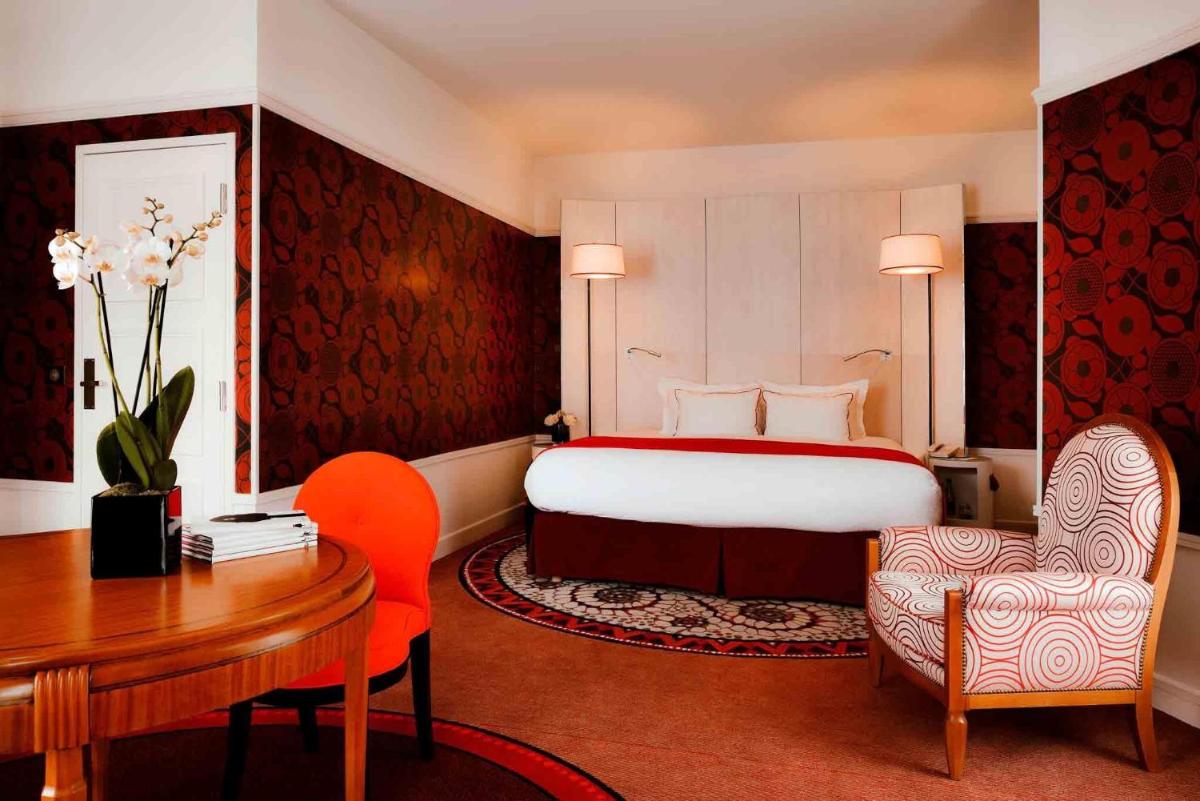 Un ou plusieurs lits dans un hébergement de l'établissement Carlton Hotel Lyon - MGallery Collection