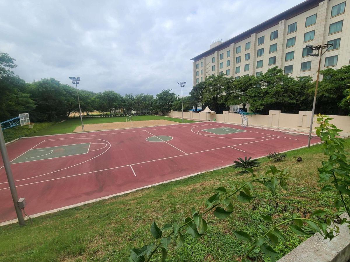 a basketball court in front of a building at Novotel Hyderabad Airport in Hyderabad