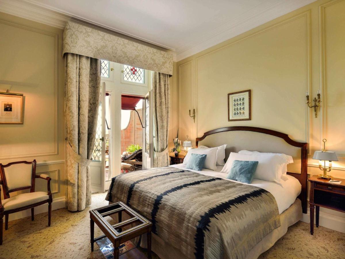 Un ou plusieurs lits dans un hébergement de l'établissement Hotel de la Cité Carcassonne - MGallery Collection
