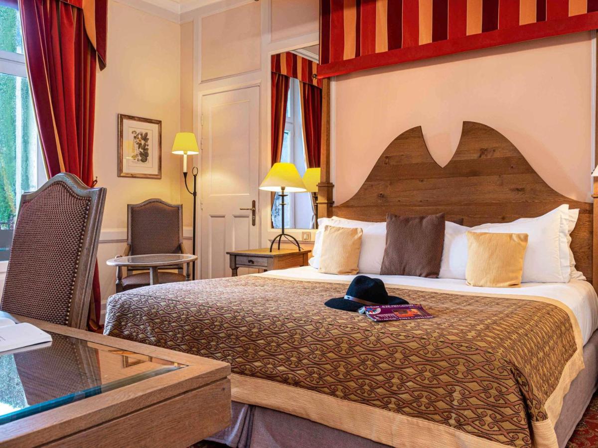 Un ou plusieurs lits dans un hébergement de l'établissement Hotel de la Cité Carcassonne - MGallery Collection