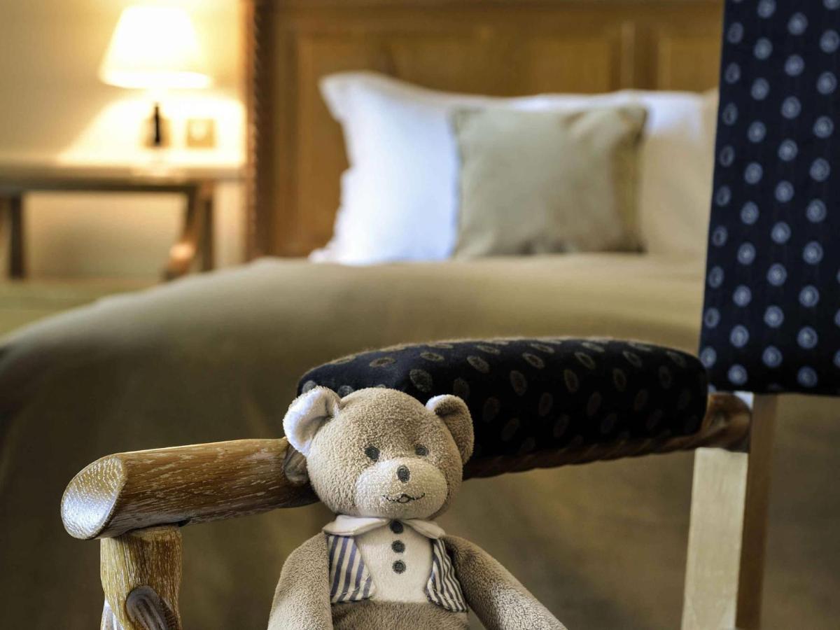 Un ou plusieurs lits dans un hébergement de l'établissement Hotel de la Cité Carcassonne - MGallery Collection