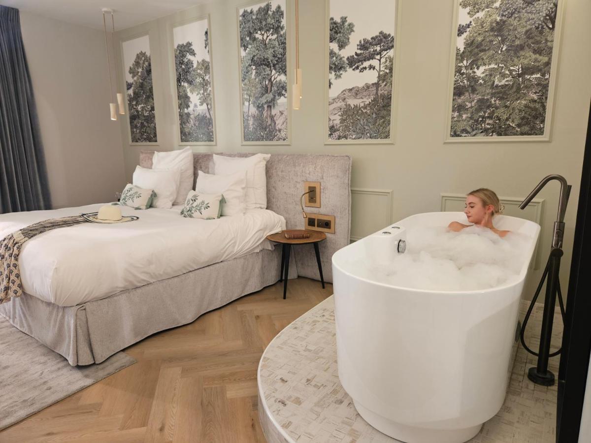 Un ou plusieurs lits dans un hébergement de l'établissement Le Belvédère Hotel et Bien être