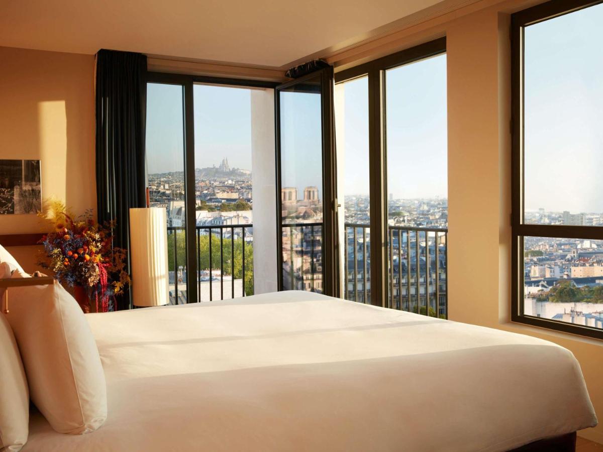Un ou plusieurs lits dans un hébergement de l'établissement SO/ Paris Hotel