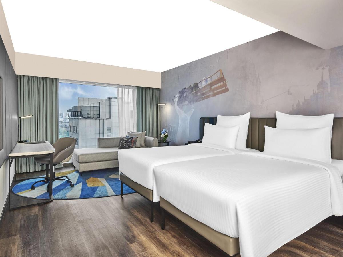 a rendering of a hotel room with a bed at Novotel Mumbai International Airport in Mumbai
