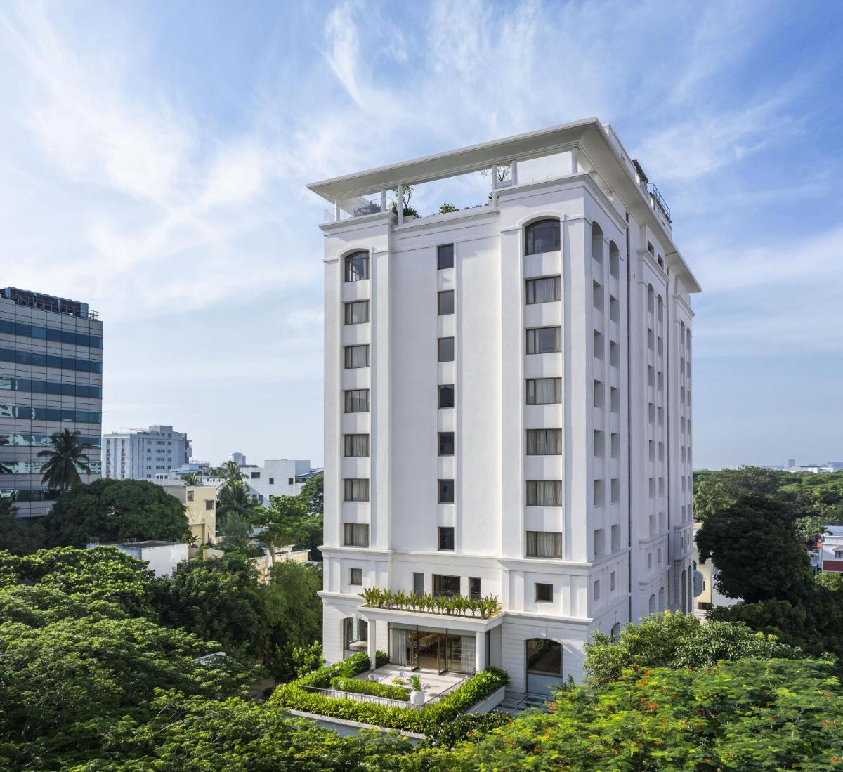 a rendering of a white building with trees at The Raintree, St. Mary’s Road in Chennai