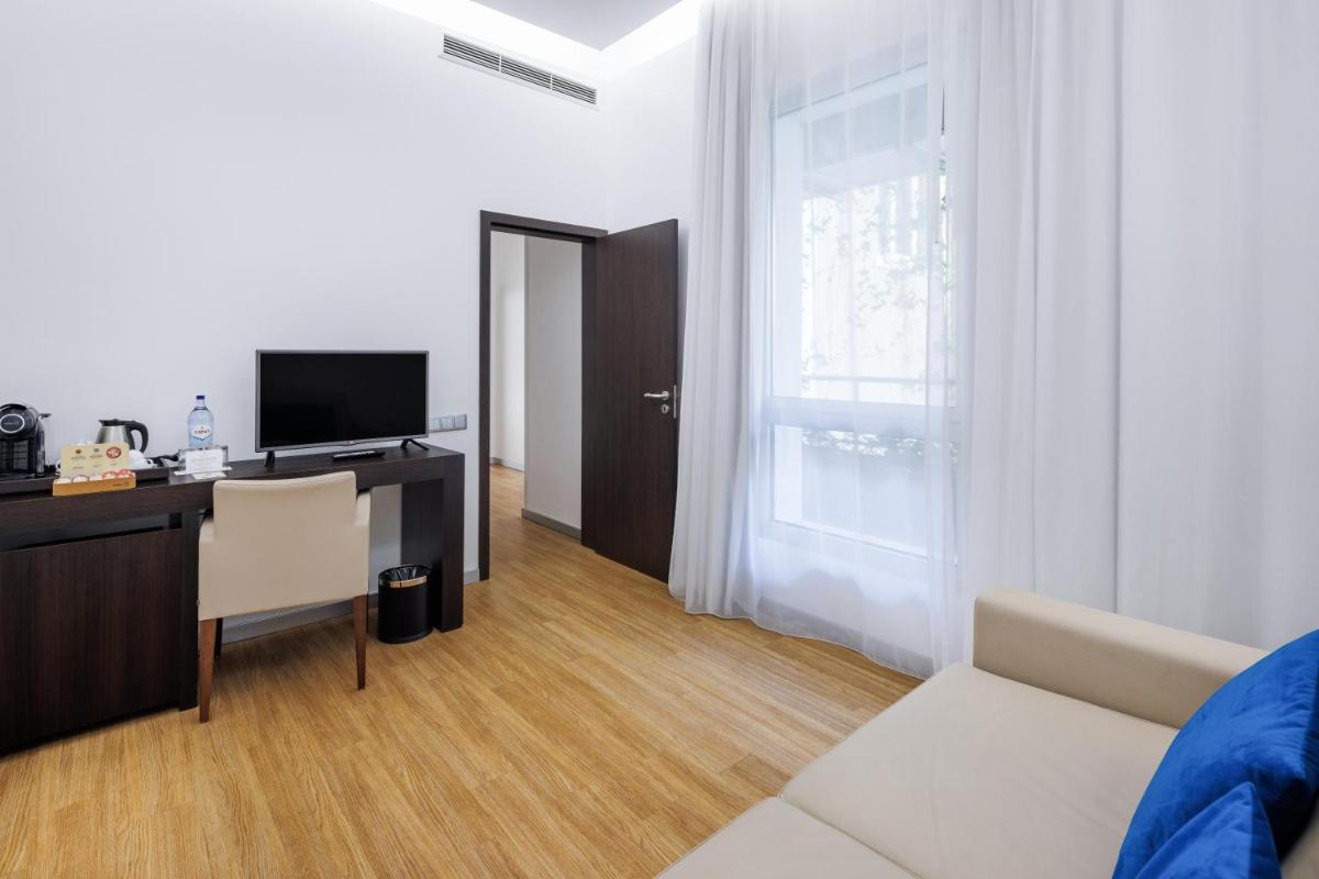 Uma televisão e/ou sistema de entretenimento em Jupiter Lisboa Hotel - Rooftop & Spa