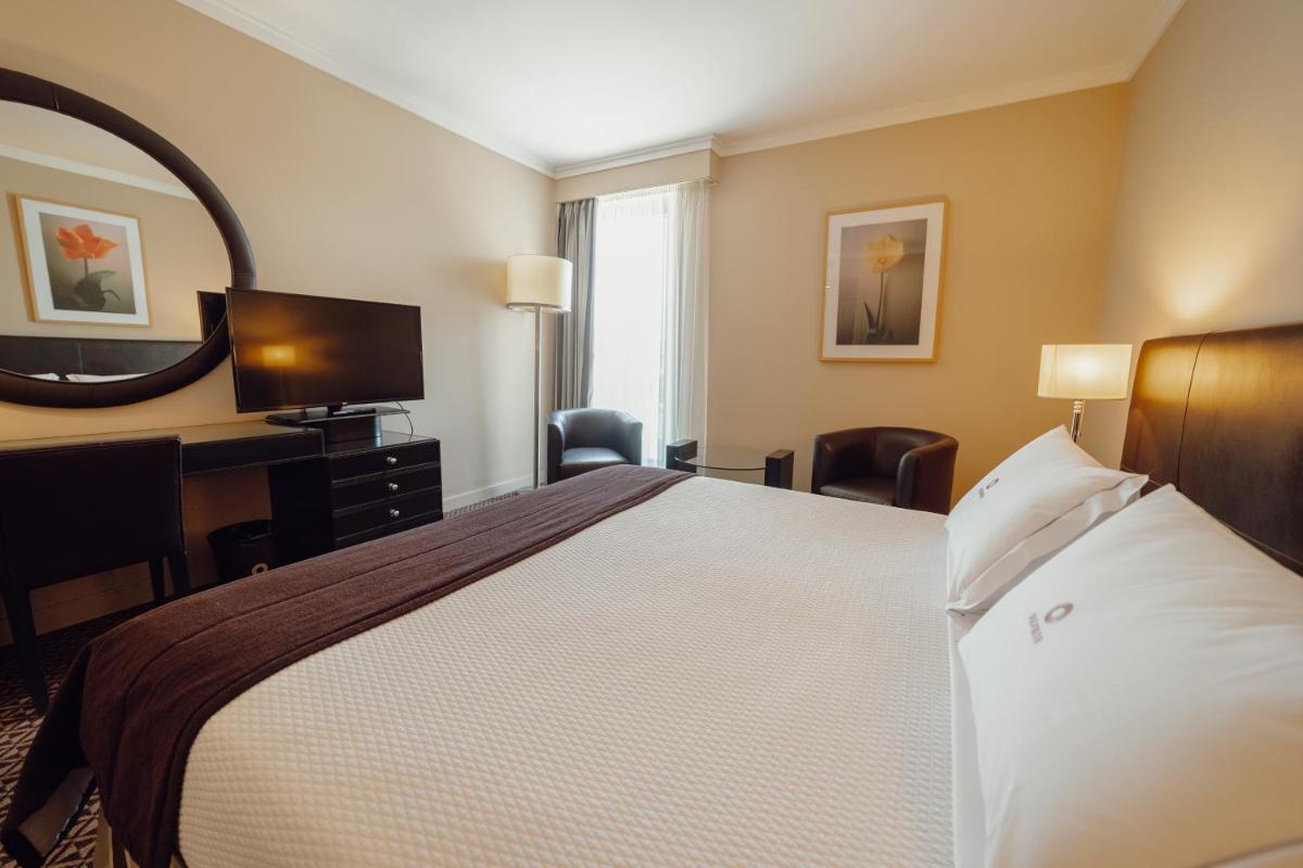 Uma cama ou camas num quarto em Hotel Solverde Spa and Wellness Center