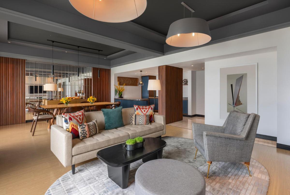 a living room with a couch and a table at The Raintree, St. Mary’s Road in Chennai