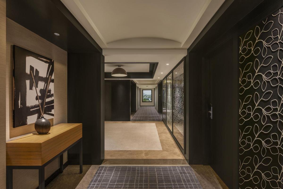 a hallway of a house with black walls at The Raintree, St. Mary’s Road in Chennai