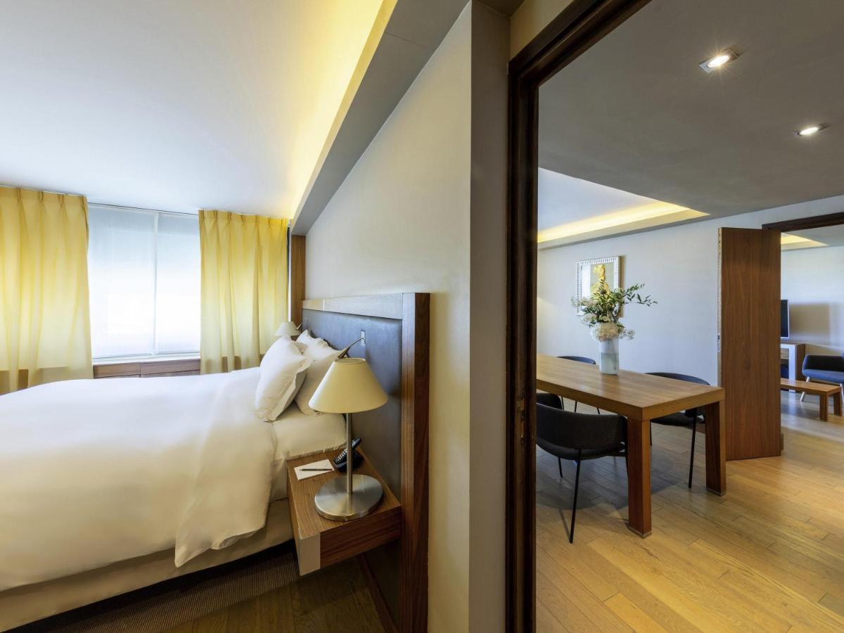 Un ou plusieurs lits dans un hébergement de l'établissement Sofitel Lyon Bellecour