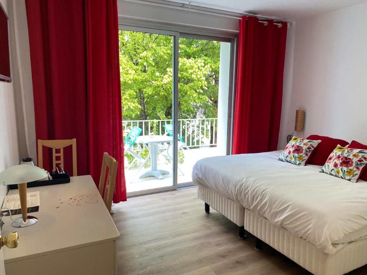 Un ou plusieurs lits dans un hébergement de l'établissement Hôtel La Ségalière Spa Bar