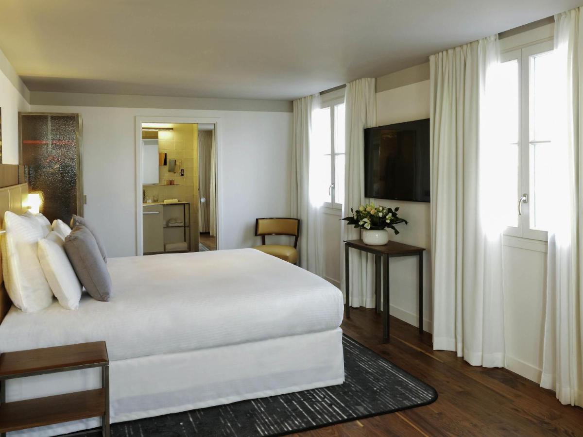 Un ou plusieurs lits dans un hébergement de l'établissement Boutet Bastille Hotel Paris - MGallery Collection