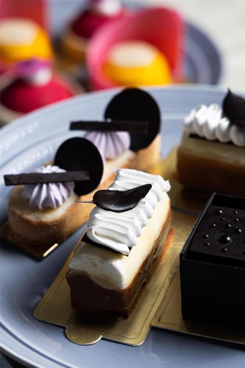 a plate with several different types of desserts on it at Radisson Blu Hotel Pune Kharadi in Pune