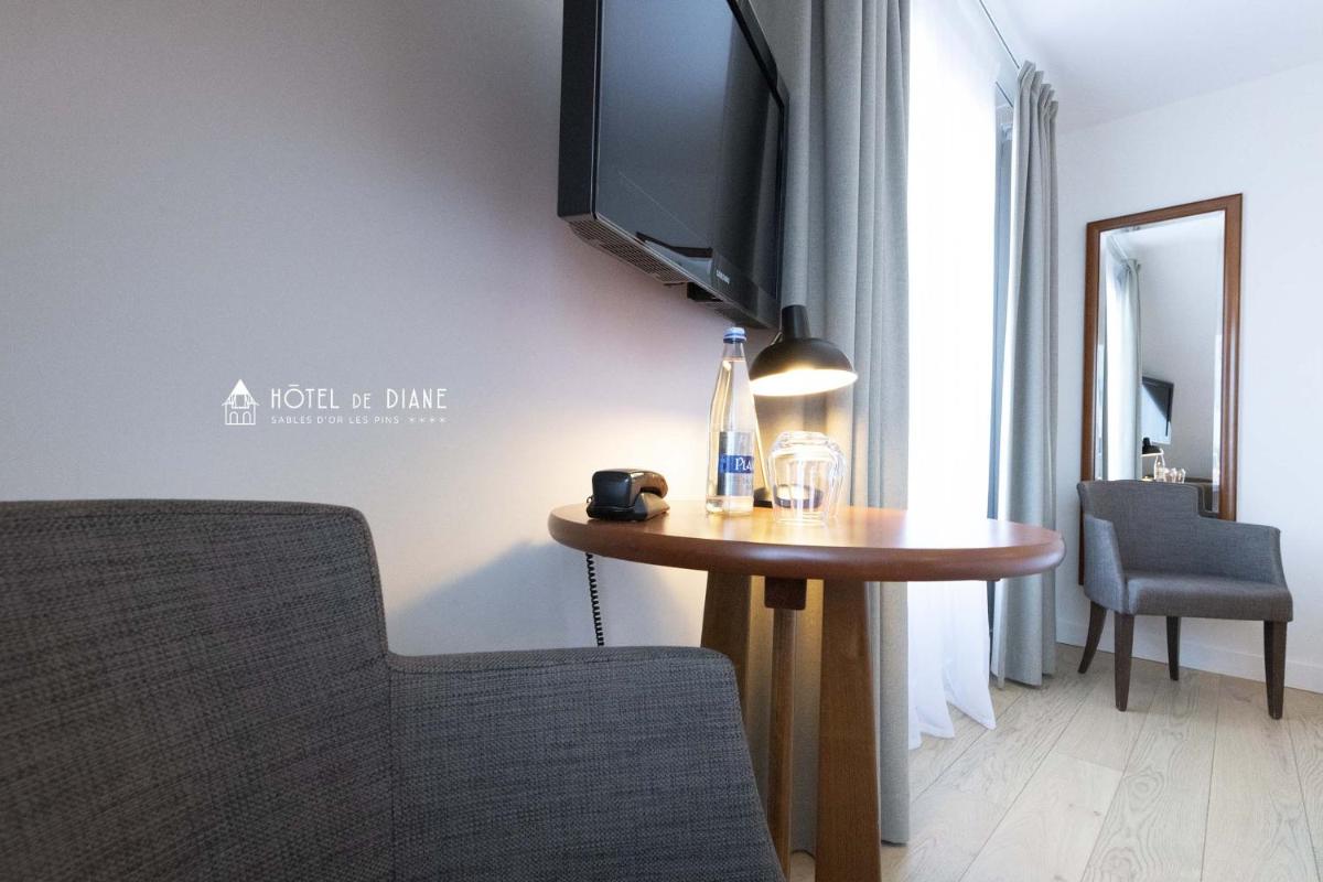Télévision ou salle de divertissement dans l'établissement Hotel De Diane