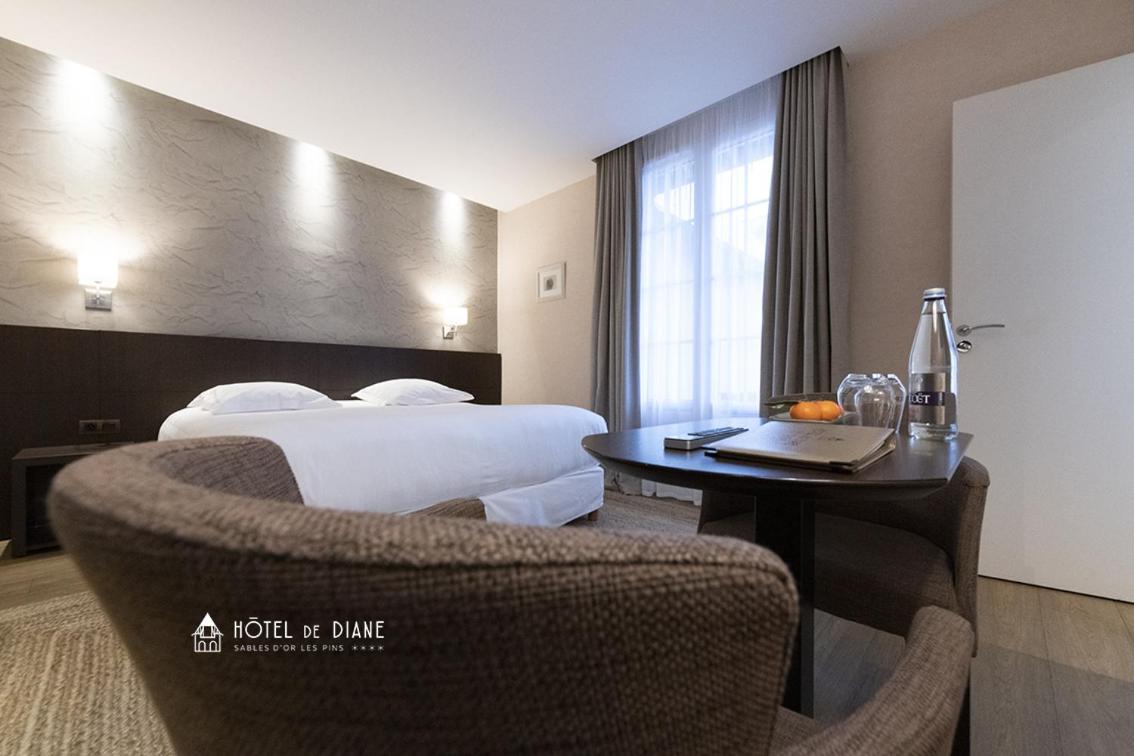 Coin salon dans l'établissement Hotel De Diane
